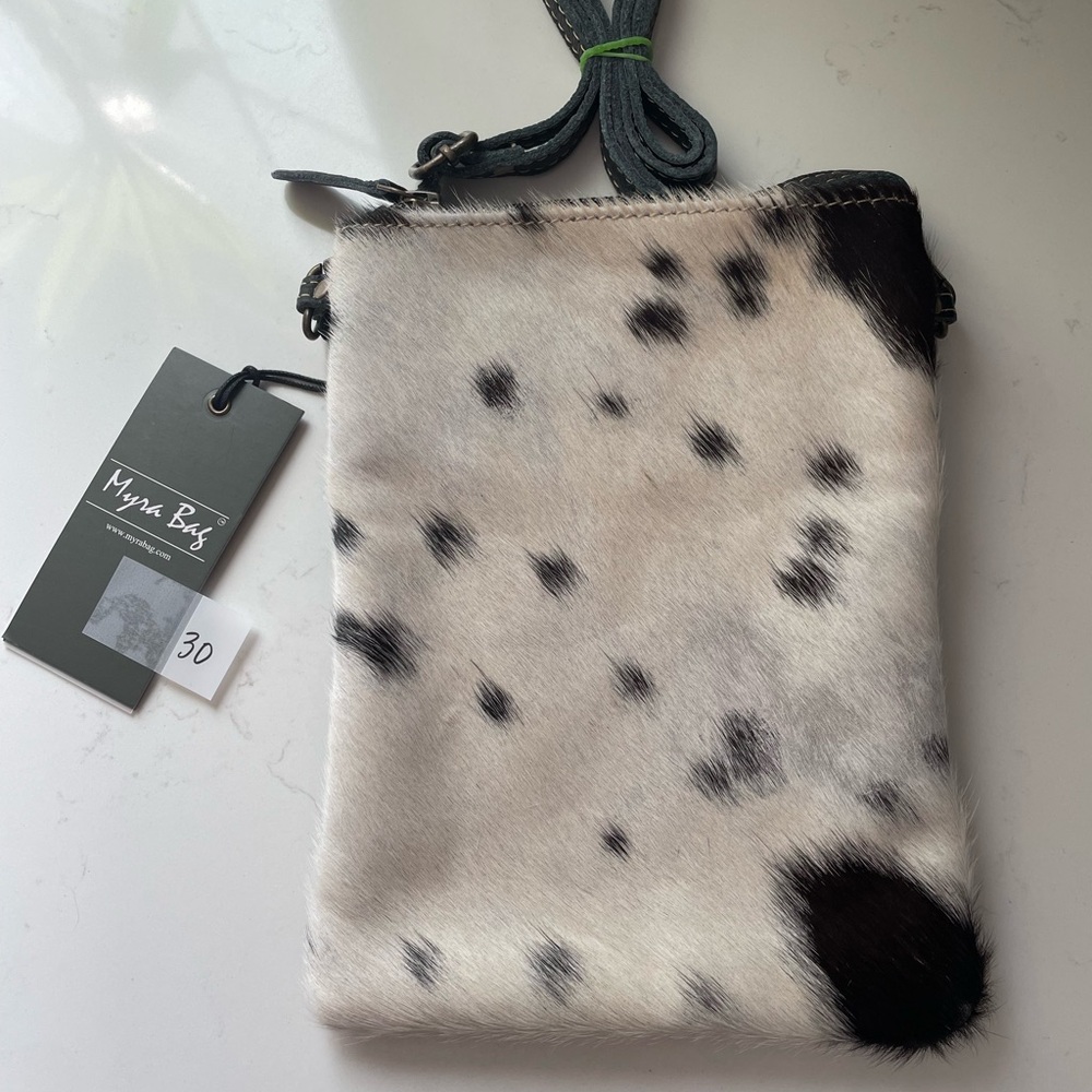 S1174 black and white cross body bag with zipper pocket outside. Cowhide